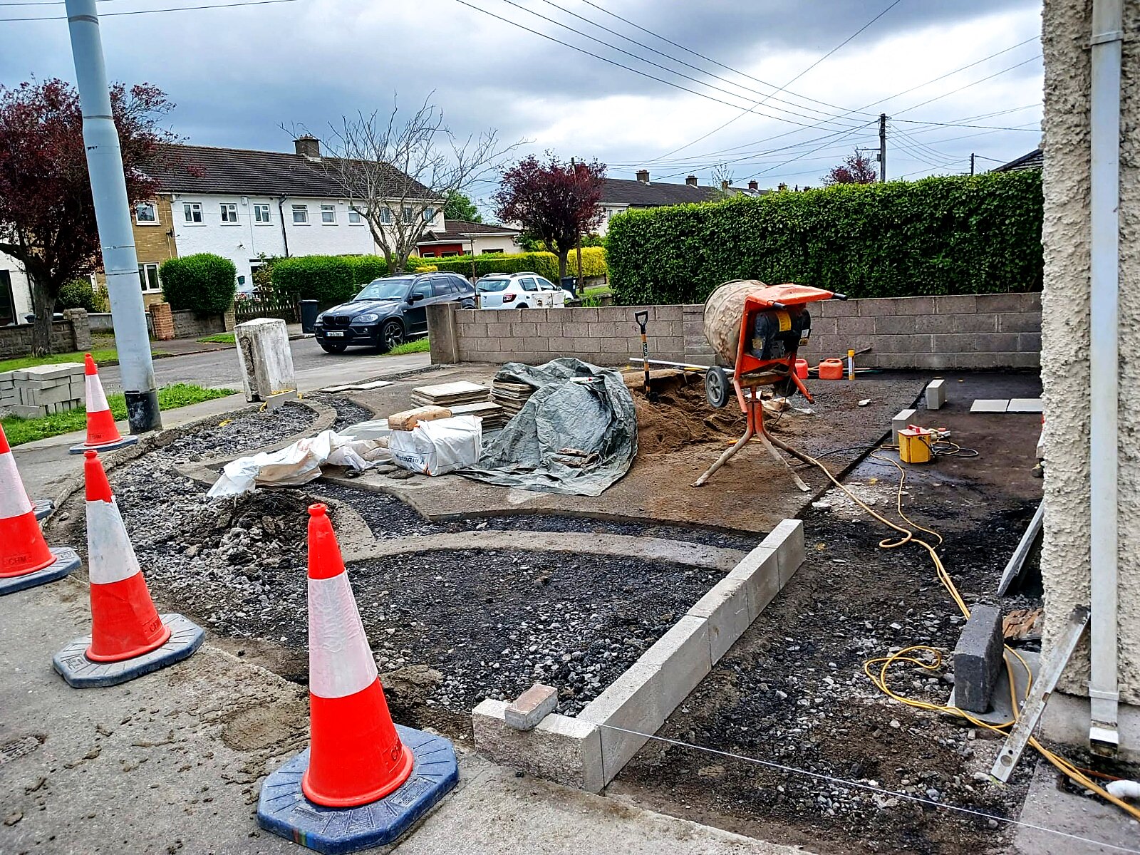 Driveway groundworks with new wall construction in progress